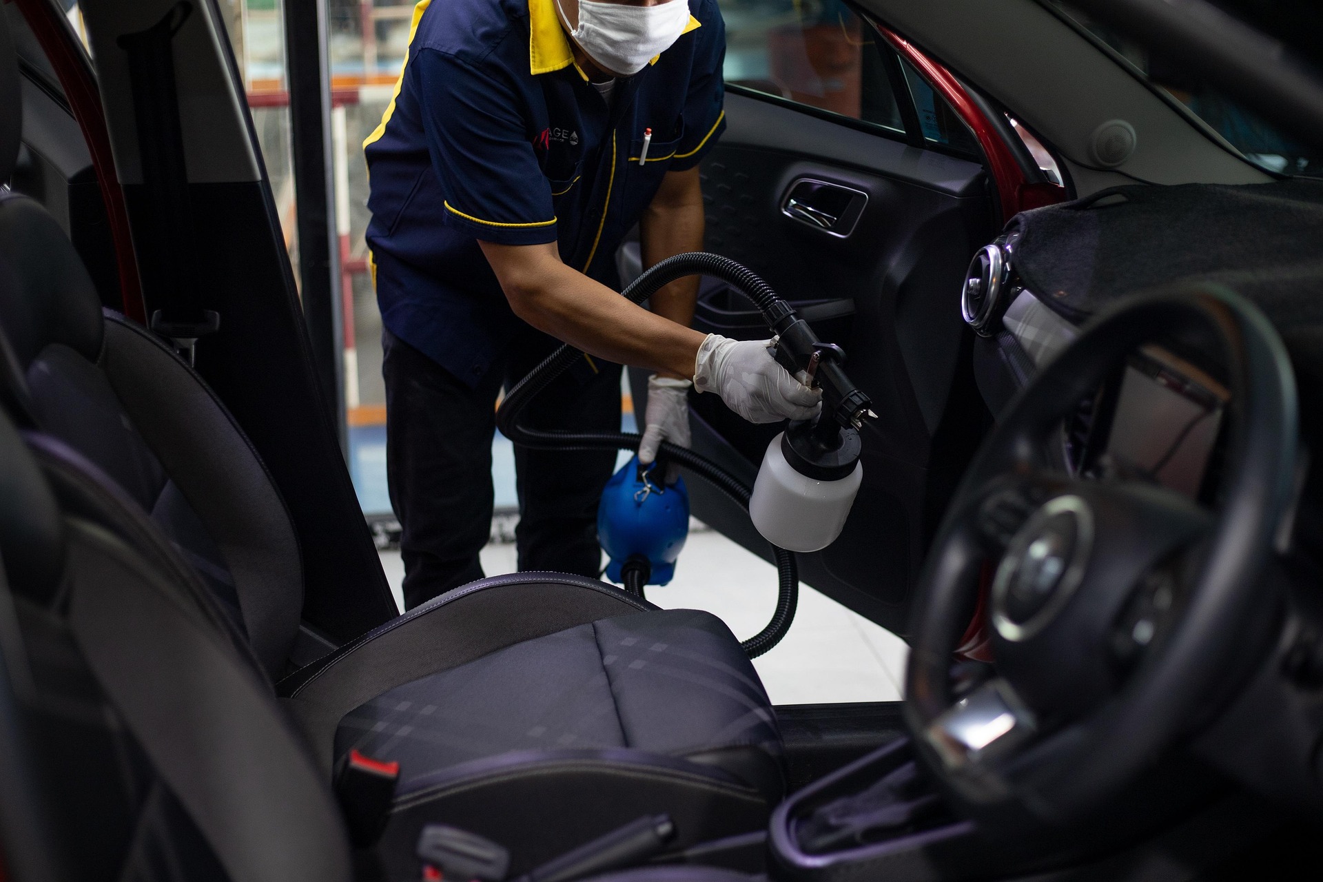 Professional car wash removing dirt and grime from a vehicle’s exterior.